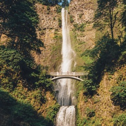 Tall waterfall between cliffs