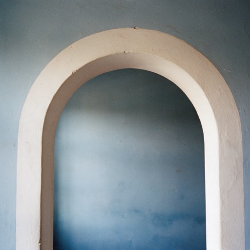 Cover of Studies: a pale arch on a blue-grey wall
